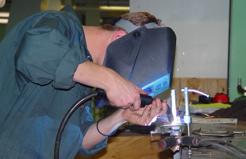 Patrick Maguire welding some metal together at USC